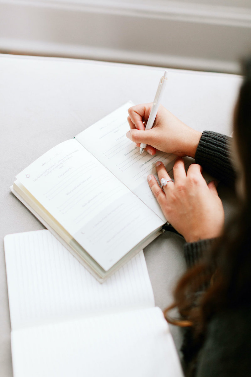 A woman writes emails optimized for her email list.