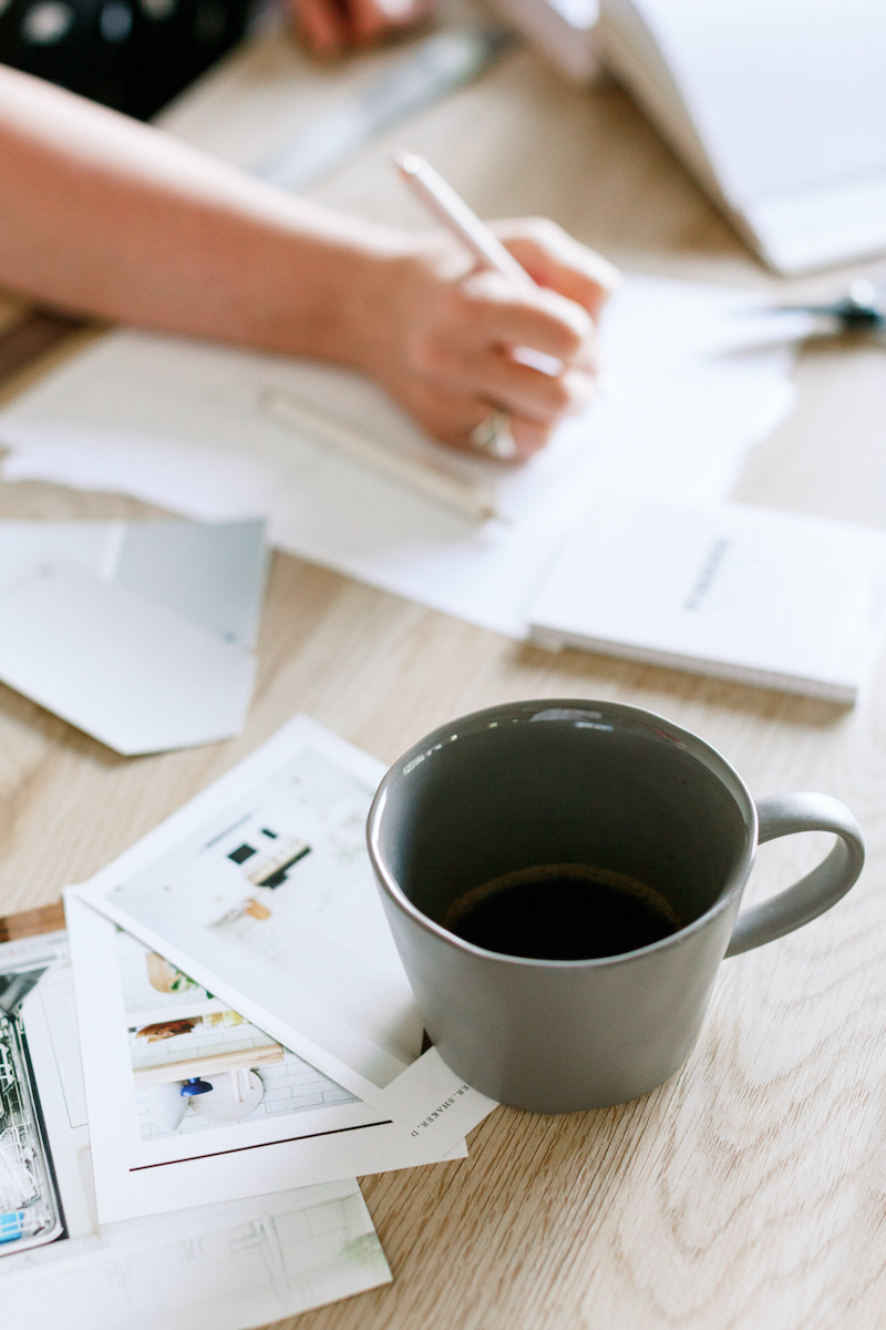 A woman plans out her email marketing strategy.